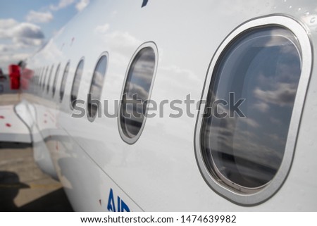 Windows of airplane with emergency sign. airplane portholes