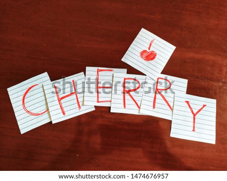 fruit cherry word write paper photo