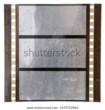 real macro photo of large format 70mm filmstrip with dust and light effect on white background, empty film cells, photo placeholder template