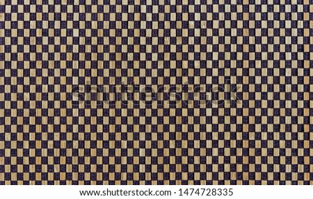 Rug with a checkered pattern with 3D effect. Background for design and decoration.