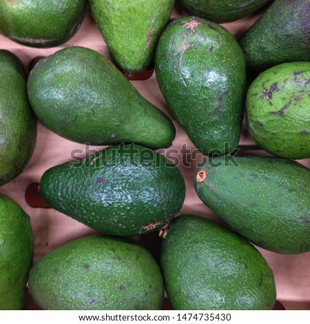 Macro photo food product vegetable avocado. Texture green and brown juicy fresh fruit avocado.