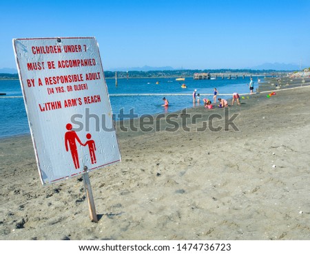 Sign at the beach notes the safety rules for children who play near the water