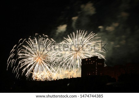 Beautiful colorful holiday fireworks in the night sky, long exposure