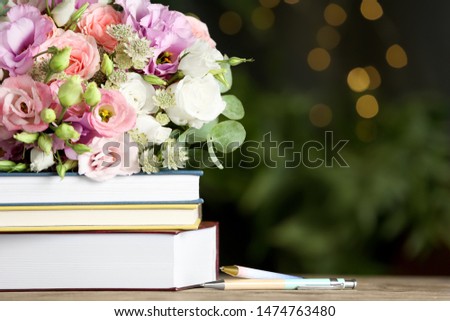 Composition with flowers and books on wooden table, space for text. Teacher's day