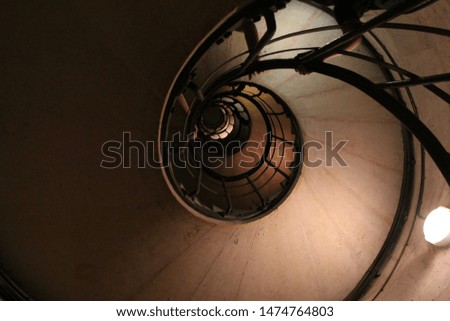a photo of the spiral staircase of the Arc de Triomphe in Paris 