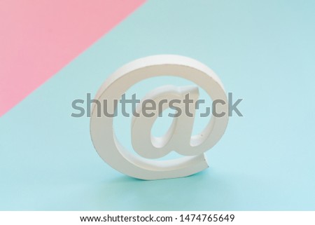Email symbol on blue and pink background. Concept for email, communication or contact us