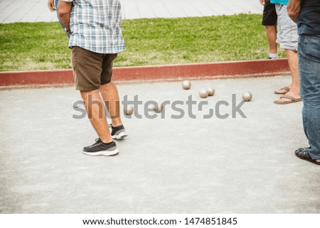 Friends play bowling in the park