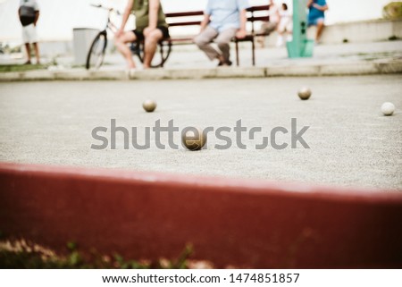 Friends play bowling in the park