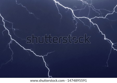 Lightnings and thunder bolt strike at summer storm