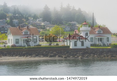 A Old Light house complex in Puget Sound near Mukilteo Washington Royalty-Free Stock Photo #1474972019