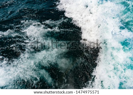 background picture of raging waves in blue cold fresh lake water