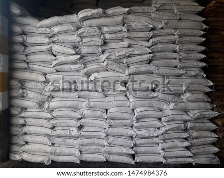 Chemical fertilizer urea The product stock is packed in sacks, stacked in the warehouse, waiting for delivery.