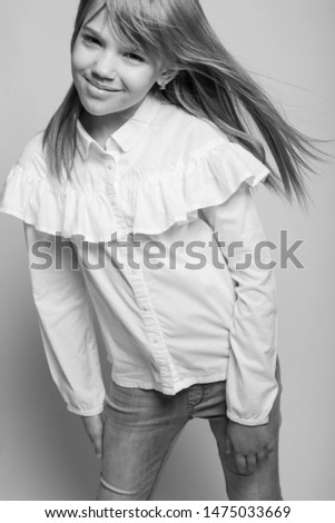 Fashionable teenager girl. Black and white photo. 