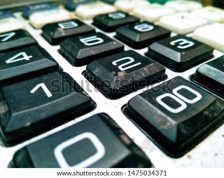 A picture of used calculater keypad with blur background