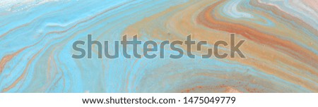photography of abstract marbleized effect background. Blue, gold and white creative colors. Beautiful paint. banner