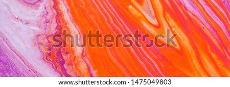 photography of abstract marbleized effect background. red, pink, orange and white creative colors. Beautiful paint. banner