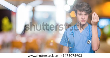 Young doctor wearing medical uniform over isolated background Doing Italian gesture with hand and fingers confident expression