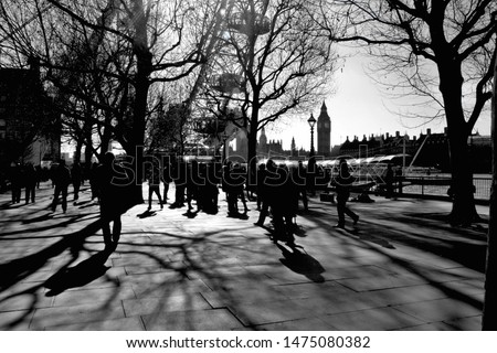 Southbank shadows, shot in London on a bright sunny day with Westminster in the distance.  Black and white London image, taken from near the London Eye