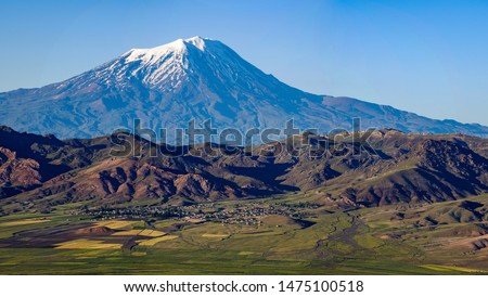 Breathtaking view of Mount Ararat, Agri Dagi, the highest mountain in the extreme east of Turkey accepted in Christianity as the resting place of Noah's Ark, a snow-capped and dormant compound volcano Royalty-Free Stock Photo #1475100518