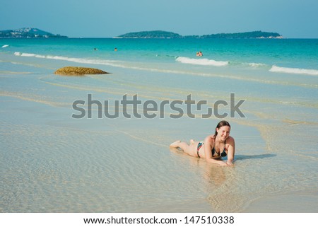 Portrait of young woman in clear water in Thailand