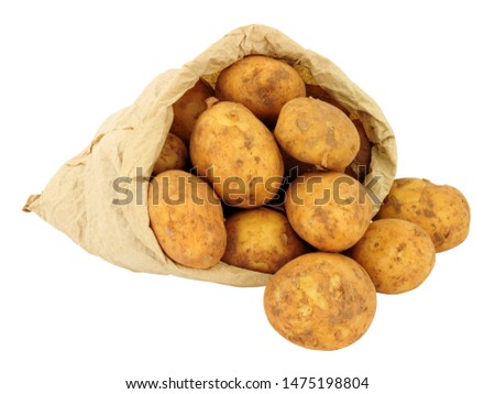 Fresh new potatoes in a brown paper bag isolated on a white background