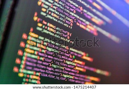 Programming Javascript on laptop computer screen. Program code PHP HTML CSS of site. Computer code on laptop (web developing). Template of website, selective focus