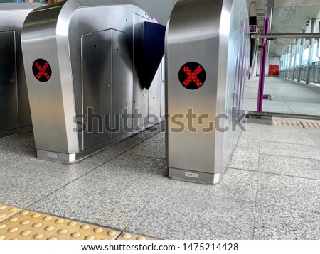 Automatic barriers for control people entered in railway station or in metro, red light show for no entrance, necessary tickets, new technologies in habitual life, automatic open and close doors