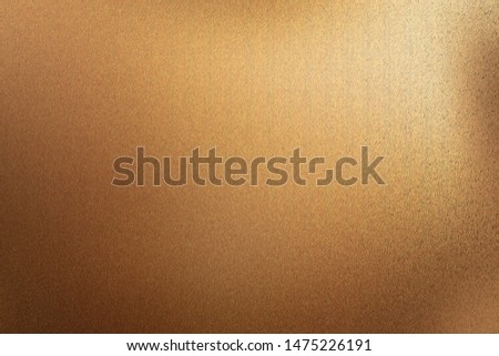 Brushed dark brown metal wall with scratched surface, abstract texture background