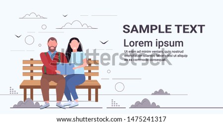 fat obese couple sitting on wooden bench reading book overweight man woman having fun together relaxing outdoor obesity concept full length flat horizontal copy space