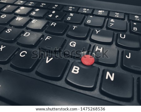 laptop keyboard red dot middle
