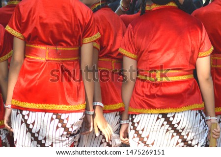 Javanese traditional dancers.  Widaninggar.  Beautiful red costume 
