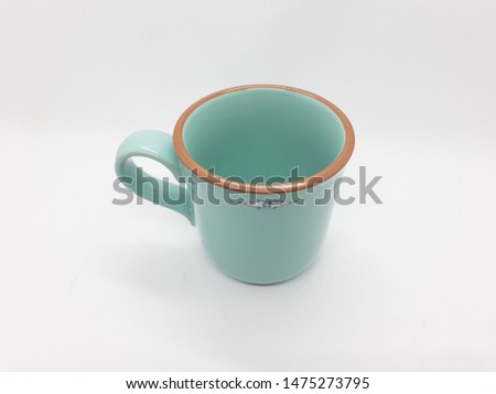 Green Ceramic Porcelain Mug or Glass for Drinking Kitchen Cafe Appliances Series in White Isolated Background