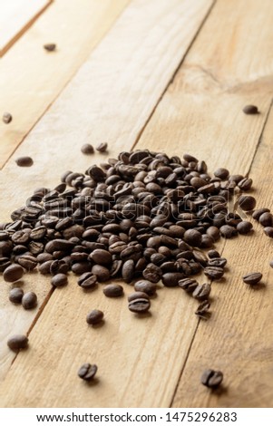 coffee beans on wooden table background. space for text