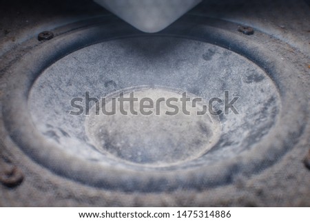 Close-up view of old dirty and dusty loudspeaker