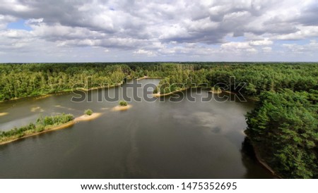 wide angle pictures from bird view perspective overlooking lakes with sandy beaches and dunes in the middle of a dense forest - Sahara Lommel