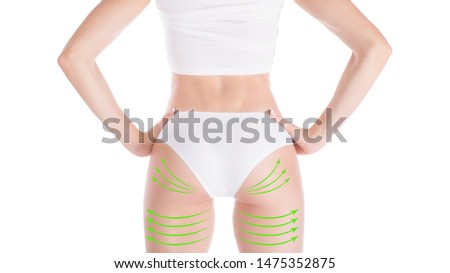 Female attractive buttocks in base underwear. Lifting marking with green arrows in womans hips and legs, isolated on white. Plastic surgery, augmentation, dieting, wellness, health, medicine and body