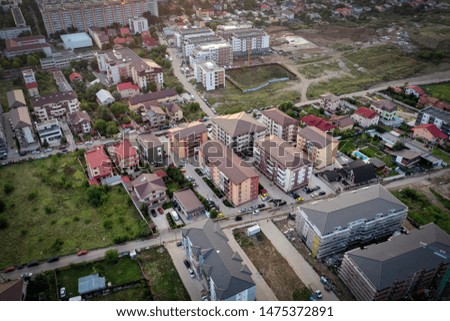 Bucharest drone city view during evening, with houses, buildings and nature