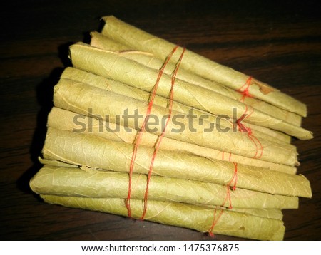 A picture of thin cigar isolated on dark background
