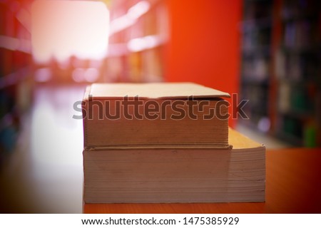 Books on study desk in a library, education or academic concept picture of learning materials. School, college, or university conceptual image. Test or exam preparation prior to the evaluation day. 