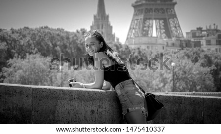 Young woman does a sightseeing trip to Paris on a sunny day - Paris street photography