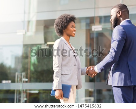 Nice to meet you. Two young african american business people introducing outdoors, copy space