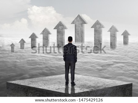 Arrow Up , Successful Businessman standing on high stone bars. solitary leader, to the goal, to win the business.