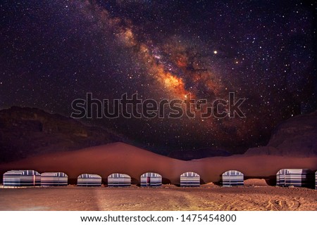 A camp in Wadi Rum desert at night with milky way, Jordan.