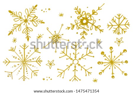Set of gold watercolor snowflakes isolated on white background. Christmas winter holiday symbol in a doodle style. Elements for background, texture, card, design, etc.
