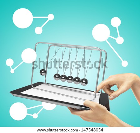 hands holding tablet with newton's cradle