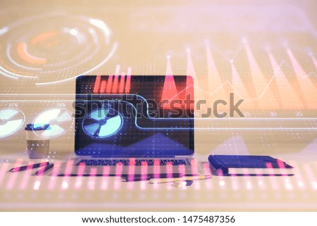Business theme concept hologram with desktop office background. Double exposure.