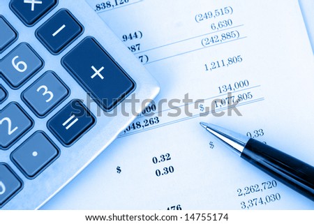 calculator on financial statement with blue overlay. Also available without blue overlay. See my other finance related pictures with or without the blue overlay.