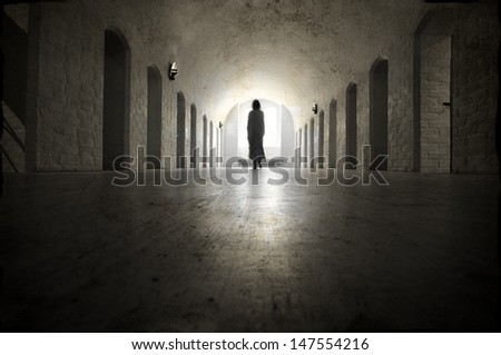 Ghost in an old medieval lunatic asylum. Royalty-Free Stock Photo #147554216