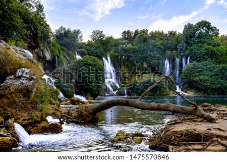 The famous waterfall in Kravice at sunset
