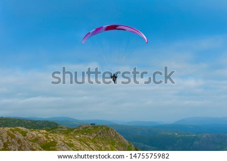 Beautiful landscape with paraglider seen from the Mount Ulriken in Bergen, Norway, on August 2019